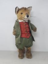 A Steiff Fox in green Jacket, Pantaloons and red Waistcoat with button in ear 14 1/2in H