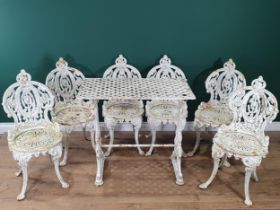 A set of six 19th Century cast iron white painted Garden Chairs with shaped and pierced back,