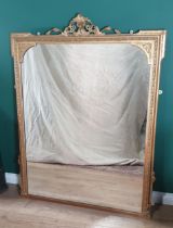 An antique gilded Overmantel Mirror with acanthus leaf scroll surmount and moulded frame A/F 4ft 7in