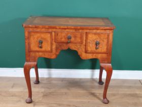 A 19th Century walnut Lowboy with quarter veneered and crossbanded top, fitted three drawers