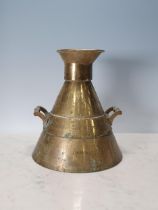 A brass imperial half gallon Measuring Flask of conical outline with cast side handles. Marked '