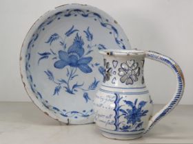 A Delft blue and white Puzzle Jug painted Birds, Flowers and Verse, with pierced neck, A/F, 7.5"