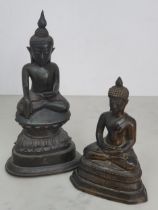 A bronze Buddha in the seated position on decorative base, 6"High and another seated Buddha, 9"