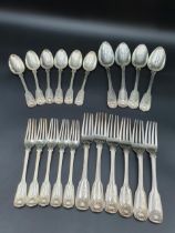 A matched part set of 19th Century silver Cutlery fiddle, thread and shell pattern engraved eagle