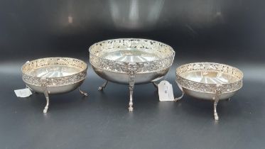 A Garniture of three early 20th Century circular Bowls with pierced fruiting vine and bead