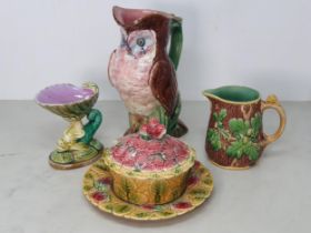 A Majolica Jug in the form of an Owl with green branch and flower handle, A/F, 9.5"High, a Minton