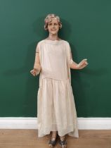 An early 20th Century plaster covered, carved Shop Display Mannikin with removeable arms and painted