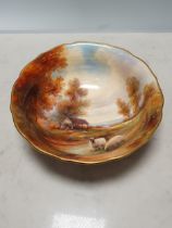 A Royal Worcester Bowl painted sheep and barn in a landscape with trees and distant view 7 3/4in D