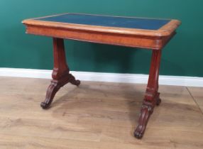 A 19th Century Oak Desk in the manner of Holland & Sons, the moulded top having inset writing