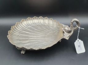 A Continental silver scallop shape Dish with dolphin handle on three scroll supports