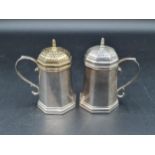 A pair of modern Tiffany & Co, Sterling silver octagonal Pepperettes with scroll handles, one