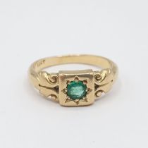 An Emerald single stone Ring set round stone in square frame, stamped 18ct, ring size L