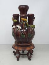 A brown glazed Chinese five necked Vase with applied coloured Squirrel and Vine decorations, with