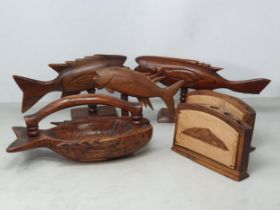 Three carved wooden Fish on stands impressed 'Pitcairn Island (one has broken lower tail fin),