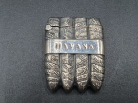 A sterling silver Havana Vesta Case in the form of a cigar case with tobacco leaf decoration,