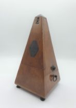 A mahogany cased Metronome, 9in high