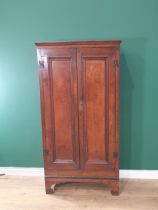 An antique oak Cupboard with pair of panelled doors on bracket supports, 5ft 2"High x 2ft 9"Wide x