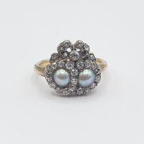 A 19th Century Pearl and Diamond ribbon and heart Cluster Ring close-set two half pearls within