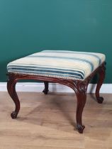 A 19th Century rosewood Dressing Stool with striped upholstered seat raised on scroll carved