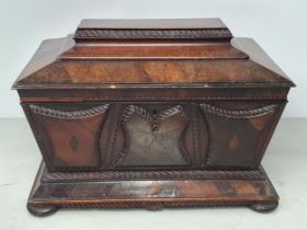 A 19th Century rosewood and mahogany Sarcophagus Tea Caddy, with applied carved panels, pair of ring