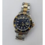 A gentleman's automatic Rolex Oyster Perpetual Date Submariner Wristwatch the black dial with hourly