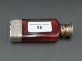 A Victorian silver-gilt lidded red glass Scent Bottle/Vinaigrette, the unmarked vinaigrette with urn