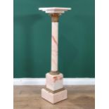 A pink variegated marble Pedestal with square top on cylindrical column with gilt metal capital on