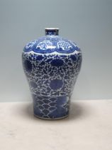 A Chinese blue and white Vase of ovoid form decorated panels with motifs and a band of floral