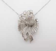 A Diamond flower spray Necklace the openwork plaque claw and millegrain-set brilliant-cut stones