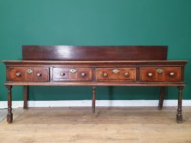 An 18th Century oak Dresser Base with raised back, fitted four crossbanded frieze drawers on