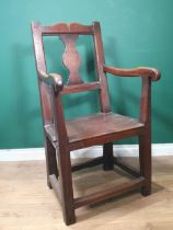 An 18th Century Welsh oak Elbow Chair with vase splat back on square supports 3ft 6in H x 1ft 11in W