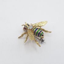 An 18ct gold Bee Brooch set ruby eyes, diamonds to body and blue and green enamel stripes to thorax,