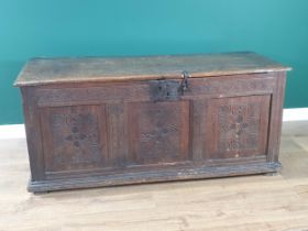 A 17th C joined Oak Coffer with moulded two plank lid and clasp lock above quatrefoil leafage carved