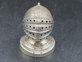 A Victorian silver Pepperette in the form of a closed helmet on circular base, Birmingham 1898,