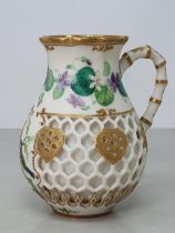 A Kerr and Binns Worcester Jug with painted floral band with great tit on branch, double wall with