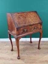 An early 18th Century walnut Bureau on later Stand, the fall front enclosing fitted pigeonhole and