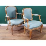 A pair of 19th Century French giltwood Armchairs with shaped backs and seats and raised on