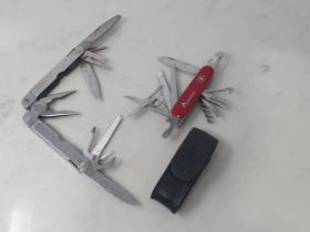 A Swiss Army 'Camping' multi-tool Penknife and a Leatherman 'Supertool' multitool Pocketknife