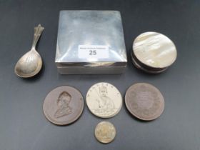 A George V silver square Cigarette Box, London 1919, a Caddy Spoon, Sheffield 1938, a white metal