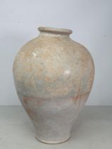 A Chinese buff pottery Vase the top half with partial clear glazing, the rim slightly misshapen,