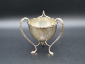 An Edward VII silver Art Nouveau three handled Cup of sinuous form, Birmingham 1904