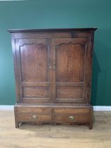 An 18th Century oak Bacon Cupboard with pair of cupid's bow panelled doors above panelled doors, 5ft