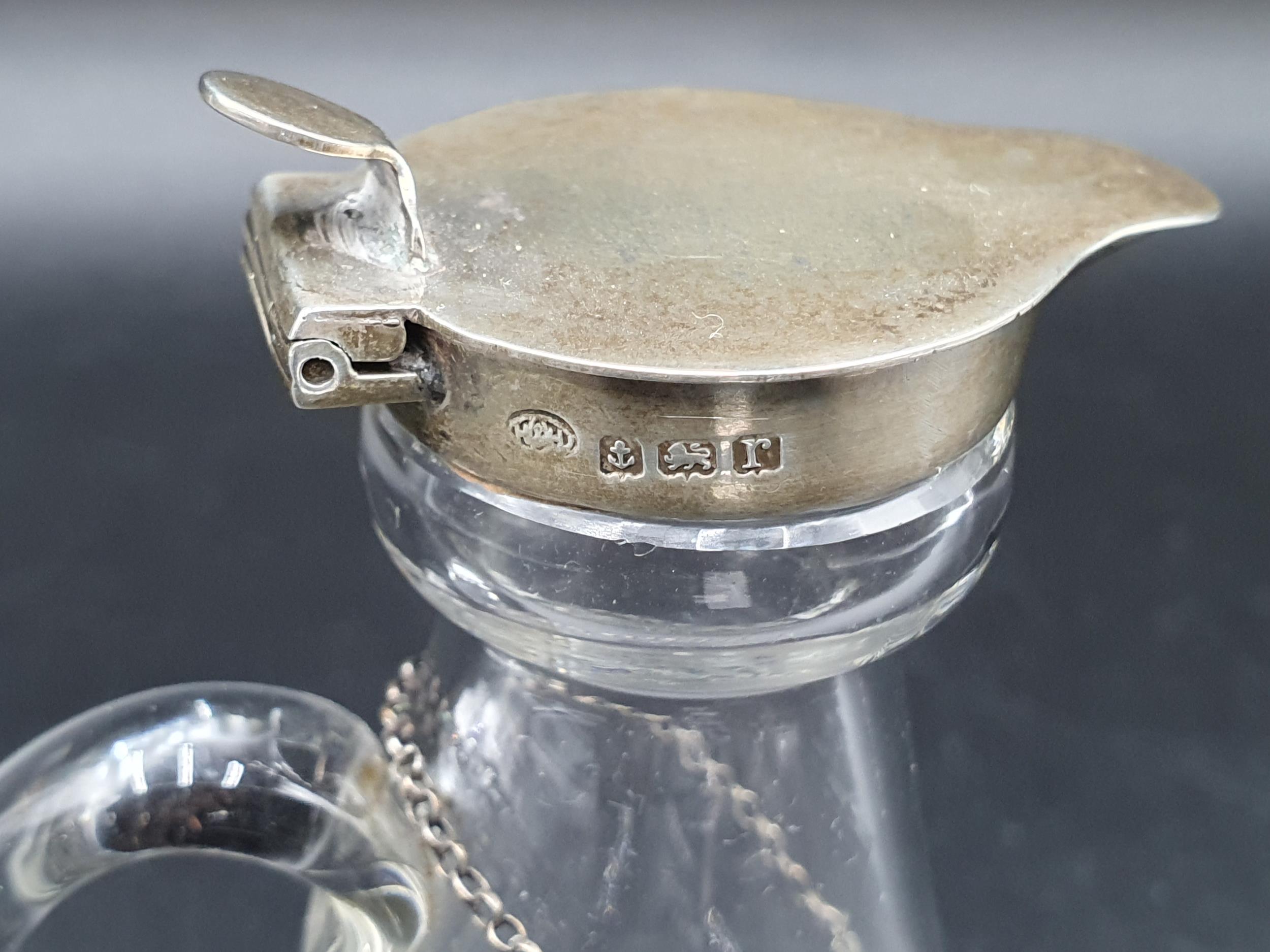 A George V silver mounted and lidded glass Toddy Flask, Birmingham 1916, and a Whiskey Label, London - Image 3 of 4