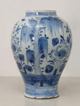An Antique blue and white Delft Baluster Vase, with Greek key style frieze, and floral and willow