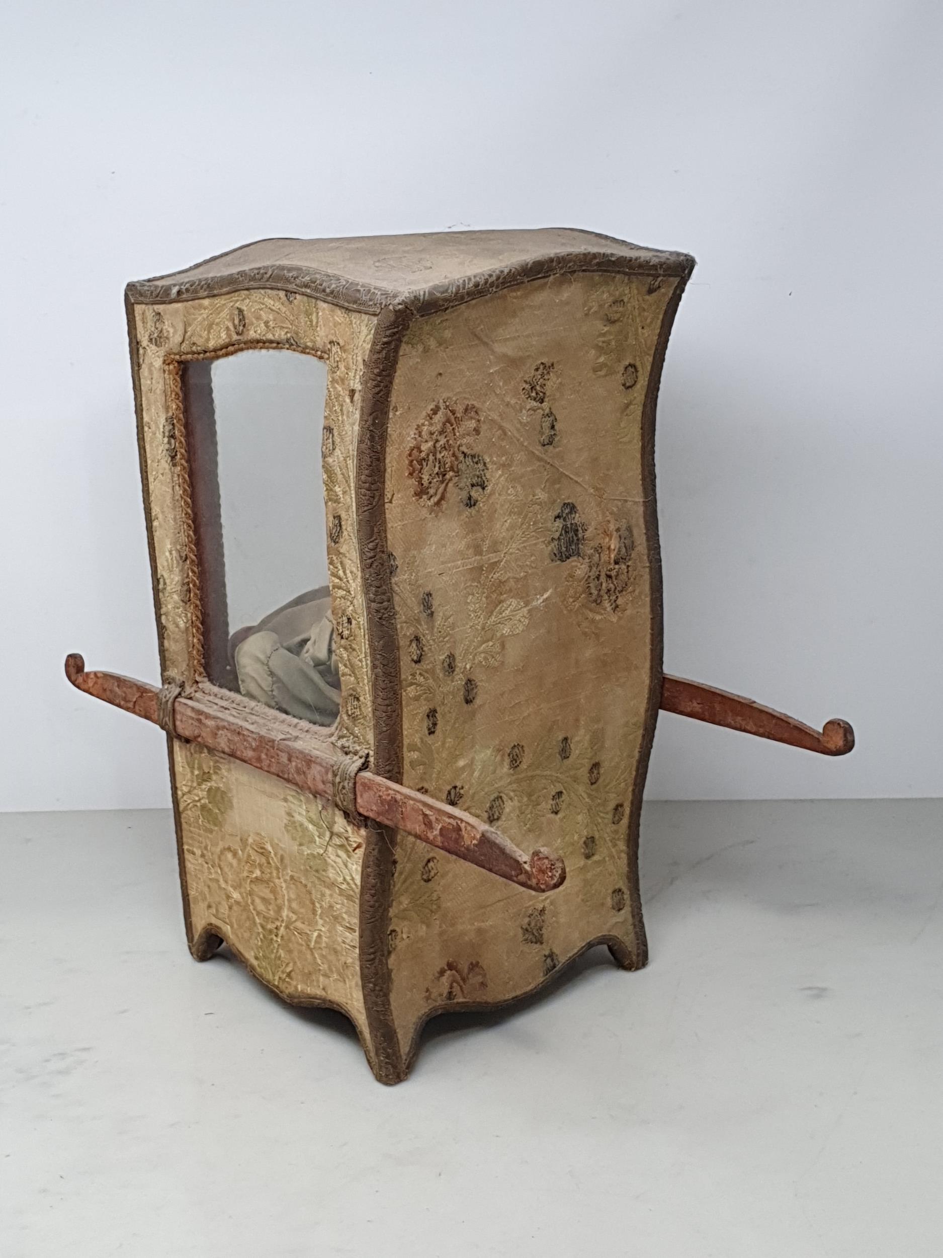 An antique Doll's Sedan Chair with fabric covering and glazed door 14in H x 7in W, with an antique - Image 3 of 4