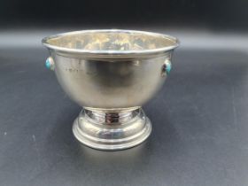 An Edward VII Cymric silver Arts and Crafts circular Bowl inset three Ruskin type turquoise