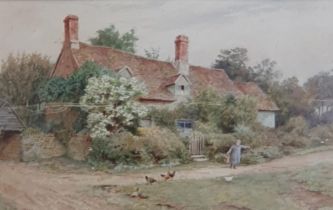 THOMAS NICHOLSON TYNDALE.(1860-1930). A Boy feeding Chickens, with cottages beyond, signed,