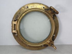 An antique brass Ship's Porthole, 16in D