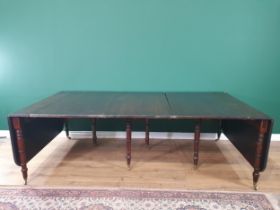 A mahogany extending Dining Table, the rounded rectangular top with reeded edge and raised on