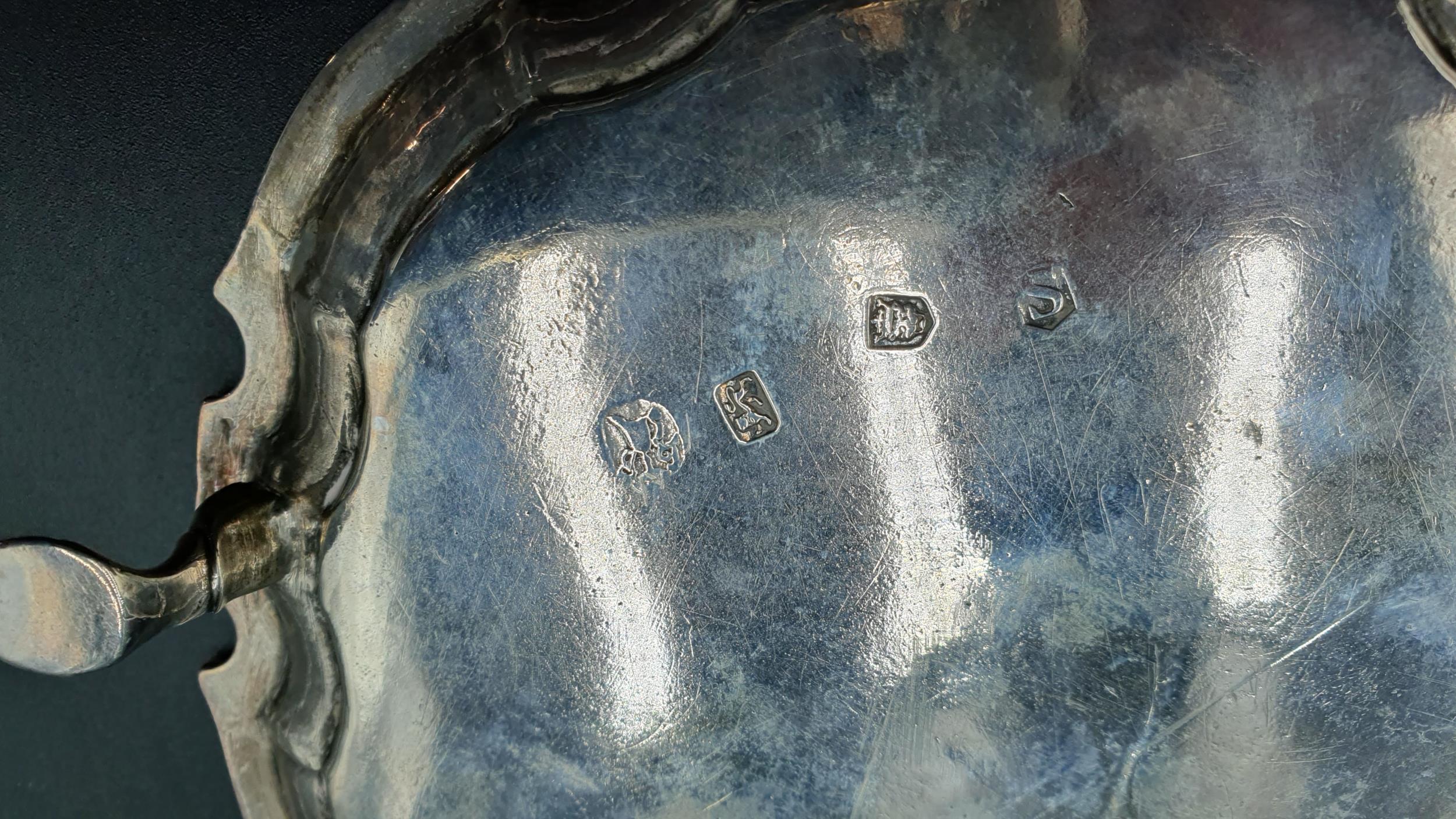 A George II silver Card Tray of shaped circular form engraved initials, on three hoof feet, London - Image 2 of 3